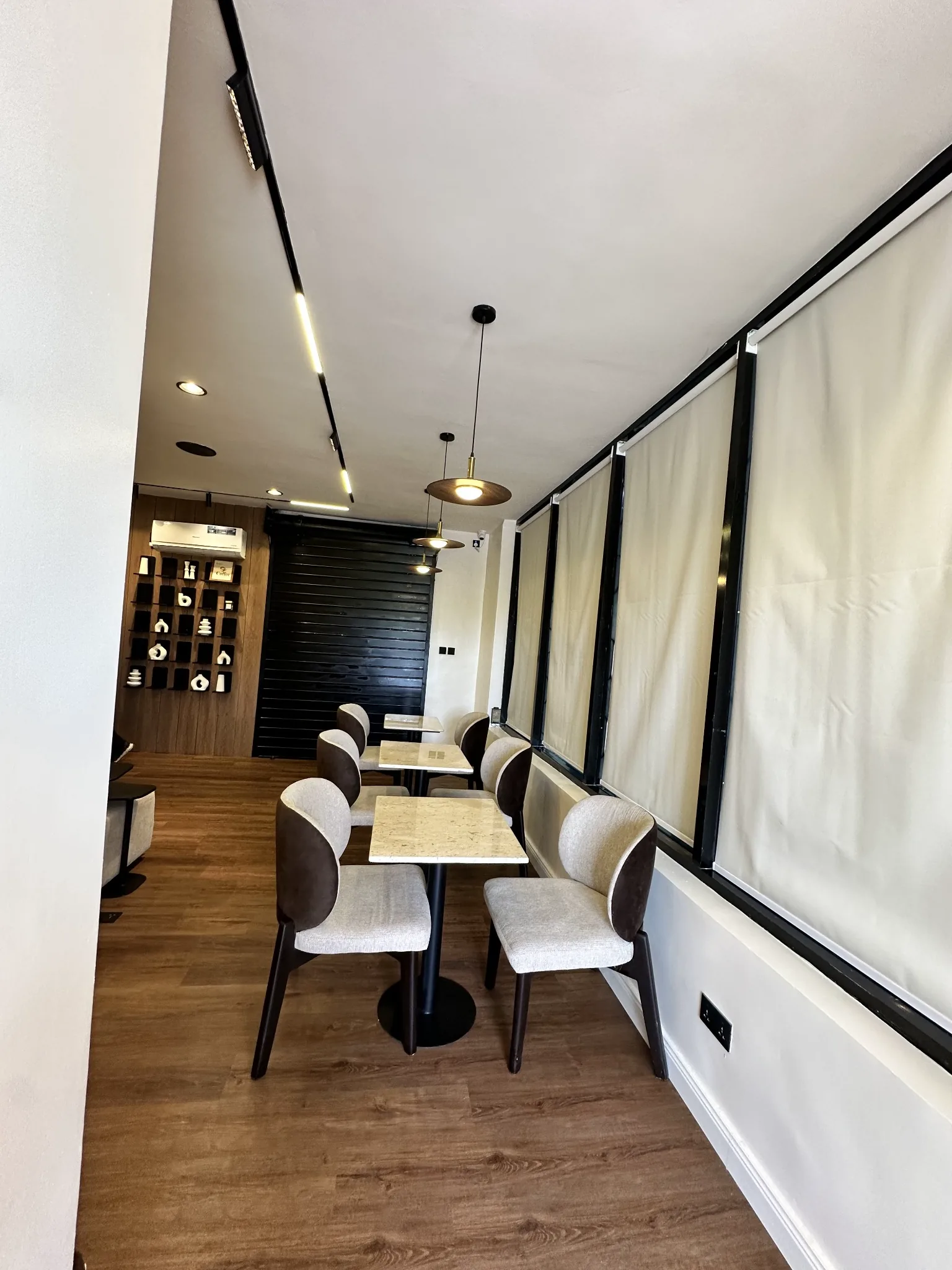 The Crumbs & Brew Café interior with comfortable seating and warm lighting